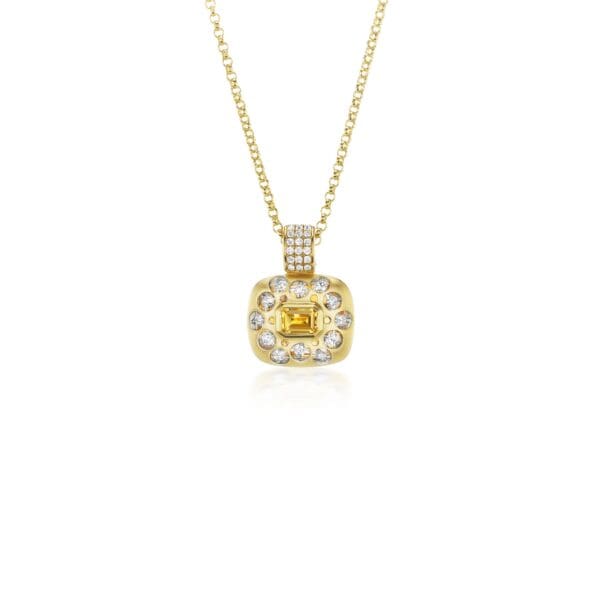 A yellow gold necklace with a diamond and white stone pendant.