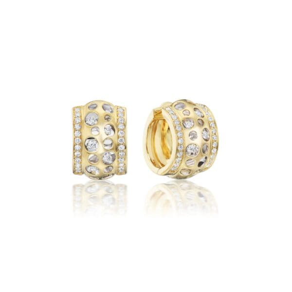 A pair of gold earrings with diamonds on them.