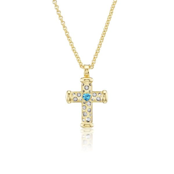 A gold cross with blue and white stones.