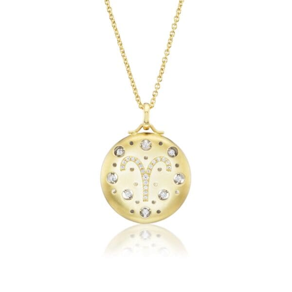 A gold necklace with a clock on it