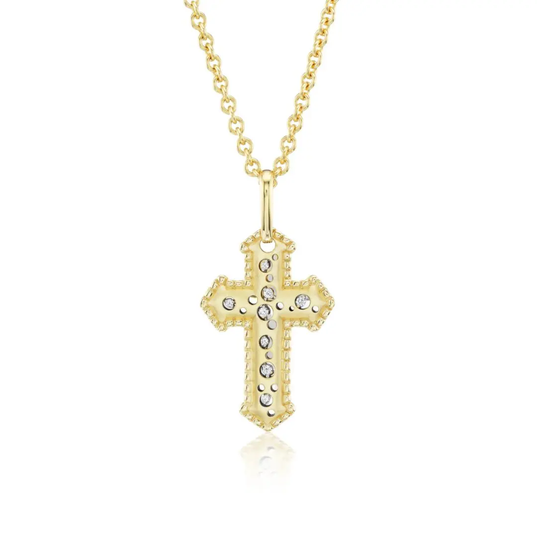 A gold cross with diamonds on it's side.