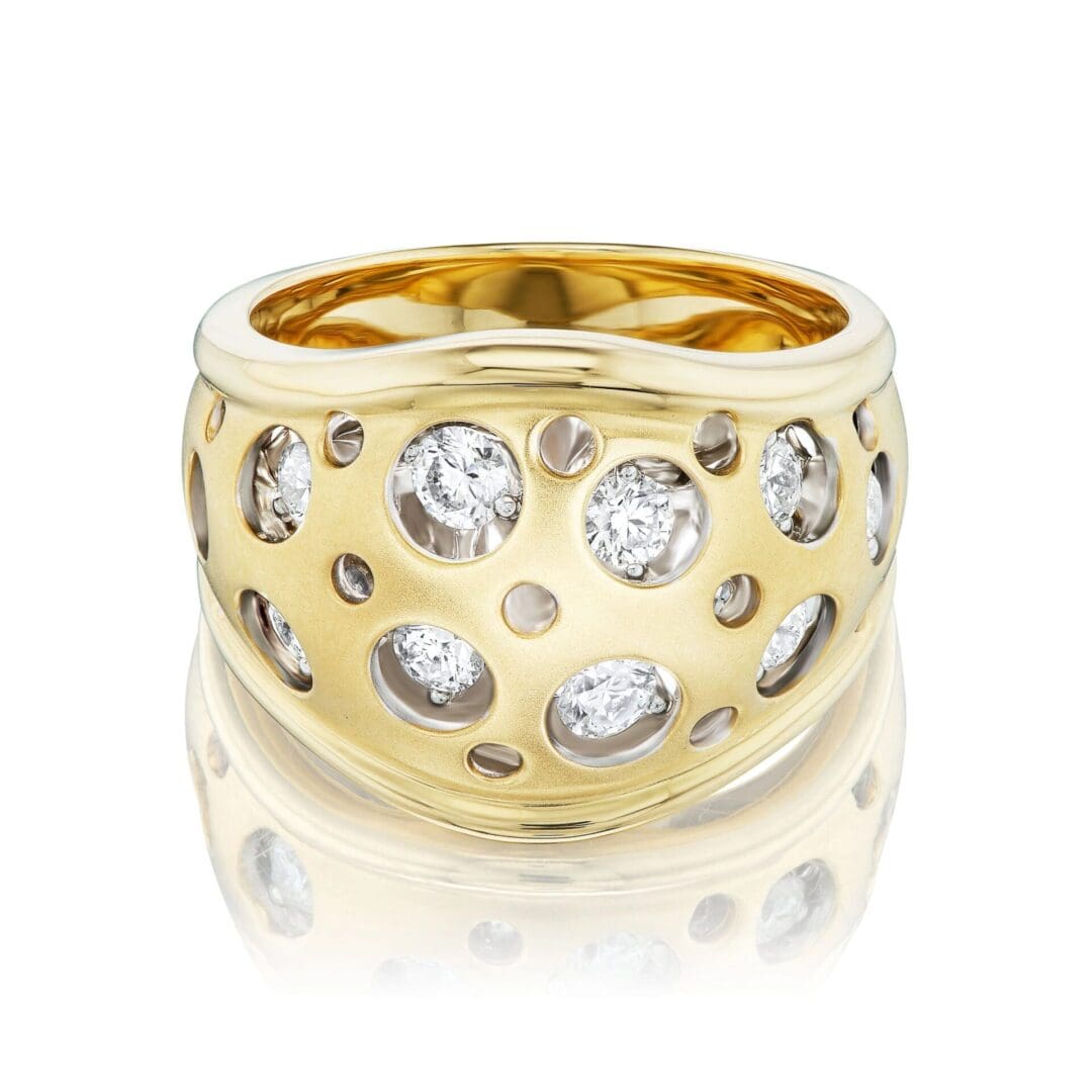 A gold ring with diamonds on it's side.