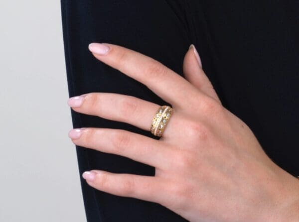 A woman is holding her hand on top of her arm.