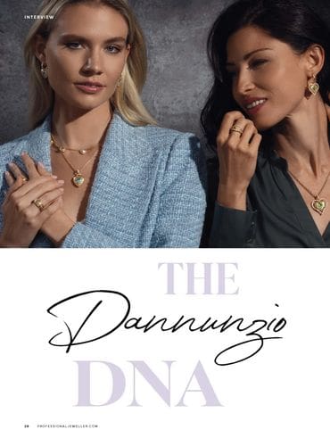 Two women wearing necklaces and earrings with a stone background