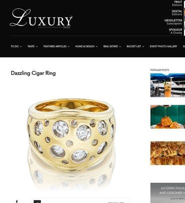 A gold ring with diamonds on it's side.