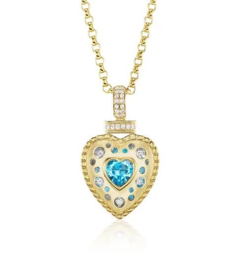 rs=w_600,h_600,cg_true (2) (1) A gold necklace with a heart shaped blue stone.