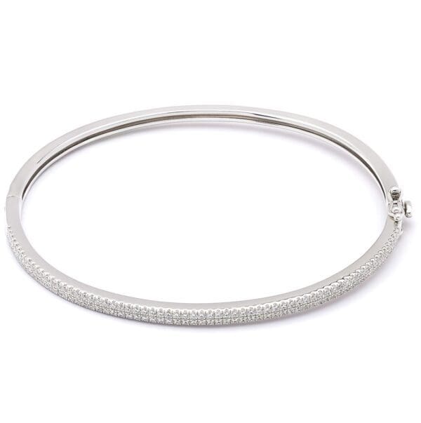 Silver bangle bracelet with diamond accents.